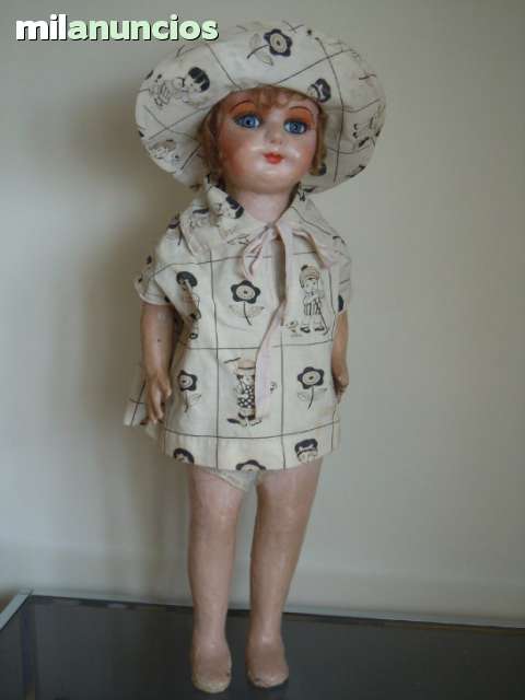 muñeca carton piedra