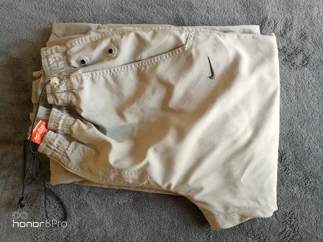 pantalones nike hombre beige